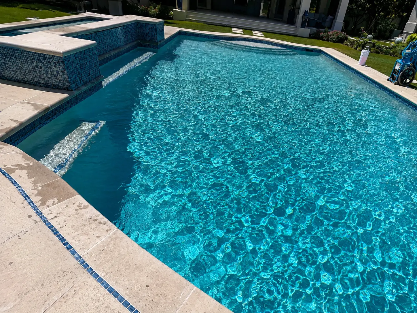 Pool & spa with glass mosaic tile — pool project by JB Pool Pros in Dallas–Fort Worth, TX